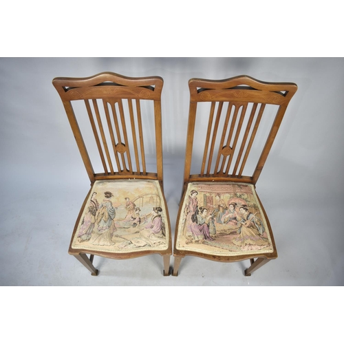 560 - A Pair of String Inlaid Edwardian Side Chairs with tapestry Seats Depicting Oriental Scenes