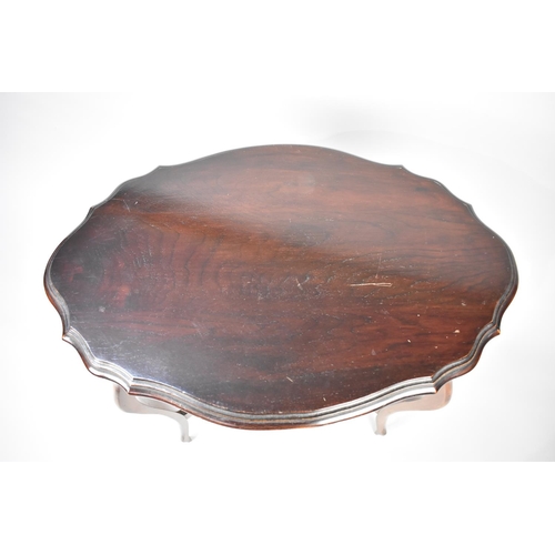 83 - An Edwardian Mahogany Oval Topped Occasional Table on Extended Cabriole Supports with Small Oval Str... 