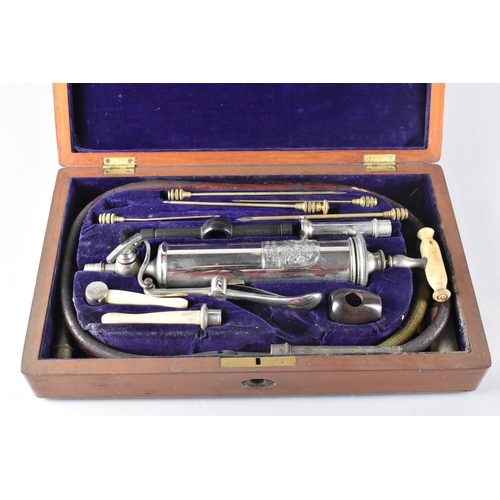 34 - A Late Victorian/Edwardian Mahogany Cased Dosing Syringe by Ferris and Co., 32x19x7cm