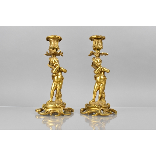 205 - A Pair of 19th Century Gilt Bronze Candlesticks Modelled with Classical Cherubs Supporting Acanthus ... 