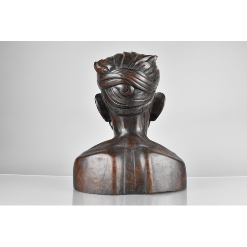 109 - An Early 20th Century Balinese Carved Hardwood Bust of an Elderly Man Wearing a Traditional Headdres... 