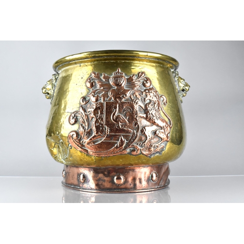 197 - A Brass and Copper Log Bin/Coal Bucket with Heraldic Crest ad Lion Mask Handles, 33.5cms High