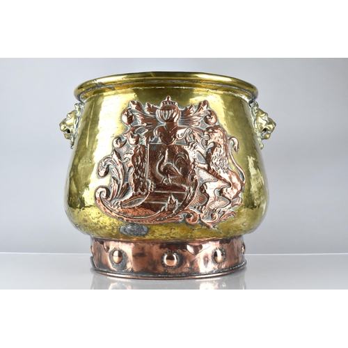 197 - A Brass and Copper Log Bin/Coal Bucket with Heraldic Crest ad Lion Mask Handles, 33.5cms High