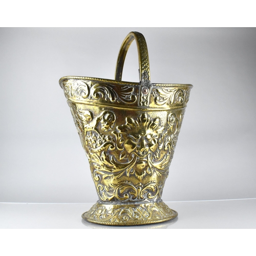 198 - A 19th Century Brass Helmet Shaped Coal Bucket with Classical Embossed Decoration, Incorporating Mas... 