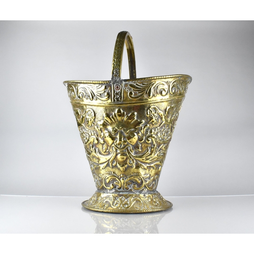 198 - A 19th Century Brass Helmet Shaped Coal Bucket with Classical Embossed Decoration, Incorporating Mas... 