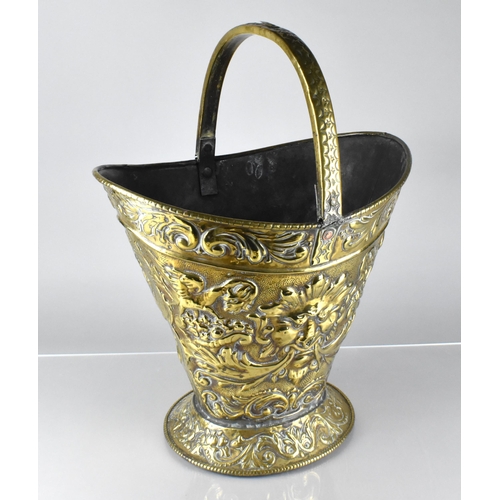 198 - A 19th Century Brass Helmet Shaped Coal Bucket with Classical Embossed Decoration, Incorporating Mas... 