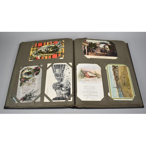 117 - An Early 20th Century Postcard Album Containing Various Colour and Monochrome Postcards, Greetings C... 