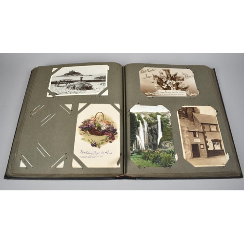 117 - An Early 20th Century Postcard Album Containing Various Colour and Monochrome Postcards, Greetings C... 