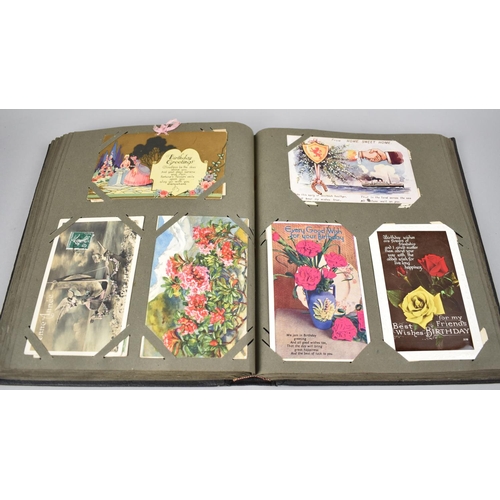 117 - An Early 20th Century Postcard Album Containing Various Colour and Monochrome Postcards, Greetings C... 