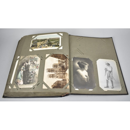 117 - An Early 20th Century Postcard Album Containing Various Colour and Monochrome Postcards, Greetings C... 