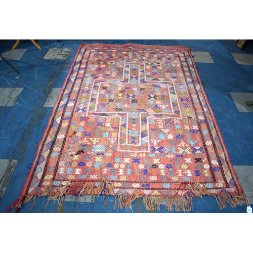 599 - A Hand Made Woolen Rug, 216x145cm