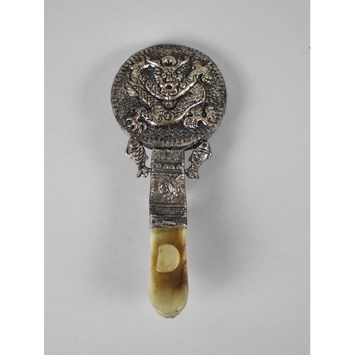 288 - A Chinese Hand Mirror Mounted in White Metal Having Dragon Relief Decoration, the Handle Formed From... 