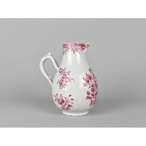 433 - An 18th Century Porcelain Jug Decorated in Pink with Flowers, 15cm high, Condition Issues