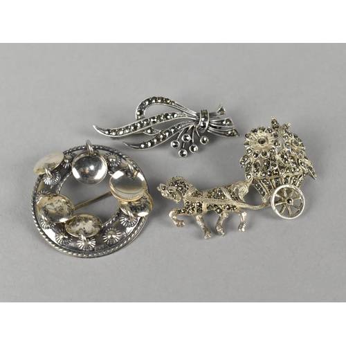 488 - A Finnish Kinetic Style Circular Brooch an Two Silver and Marcasite Brooches, Horse and Cart of Flow... 