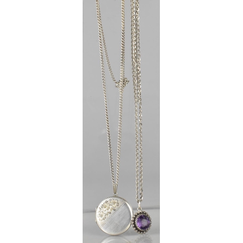 489 - A Silver Locket and Chain by HG&S, Birmingham 1977, together with a Silver and Purple Jewelled Penda... 