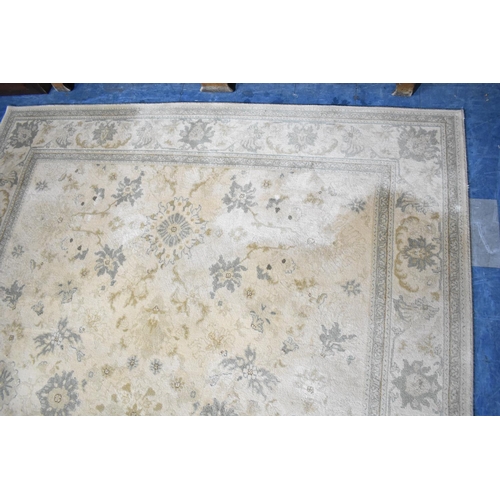 551 - A Large Patterned Rug on Faun Ground, 347x250cm