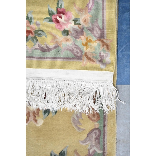 557 - A Modern Chinese Woollen Hearth Rug on Faun Ground, 130x62cm