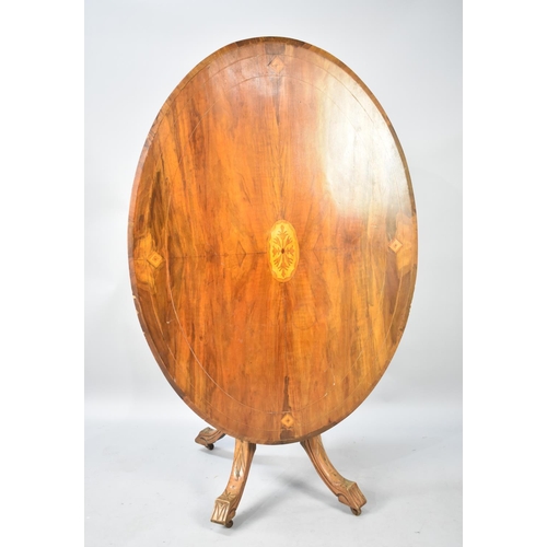 571 - A Late Victorian Inlaid Oval Snap Top Table with Carved Quatrefoil Base, 117x85cm