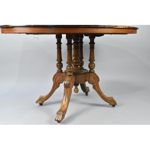 571 - A Late Victorian Inlaid Oval Snap Top Table with Carved Quatrefoil Base, 117x85cm