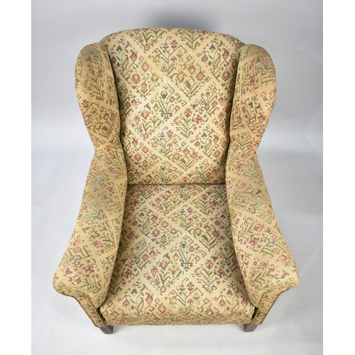 581 - An Edwardian Tapestry Upholstered Wing Armchair