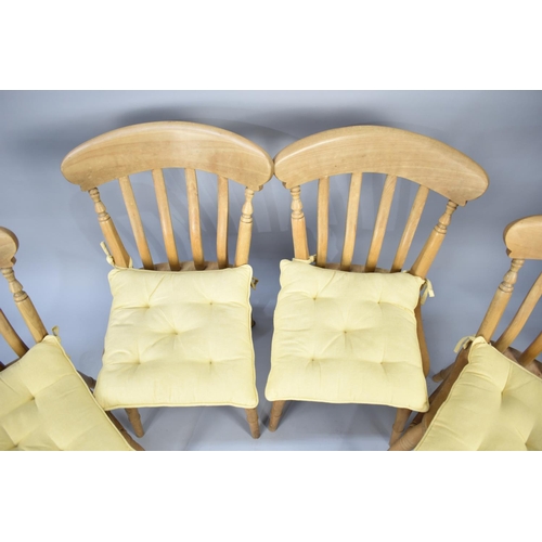 582 - A Set of Four Modern Pine Kitchen Chairs