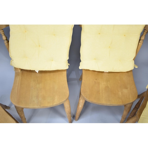 582 - A Set of Four Modern Pine Kitchen Chairs