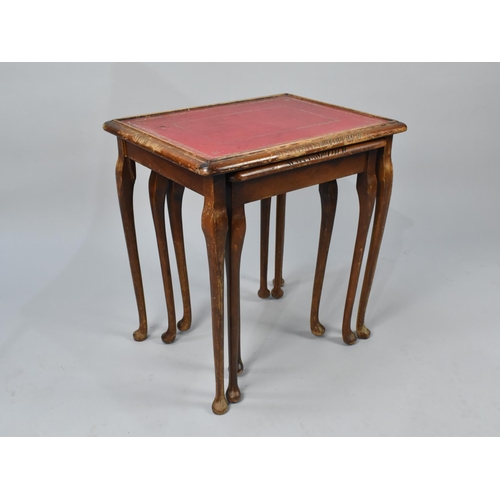 588 - A Nest of Three Modern Tables with Tooled Leather Tops