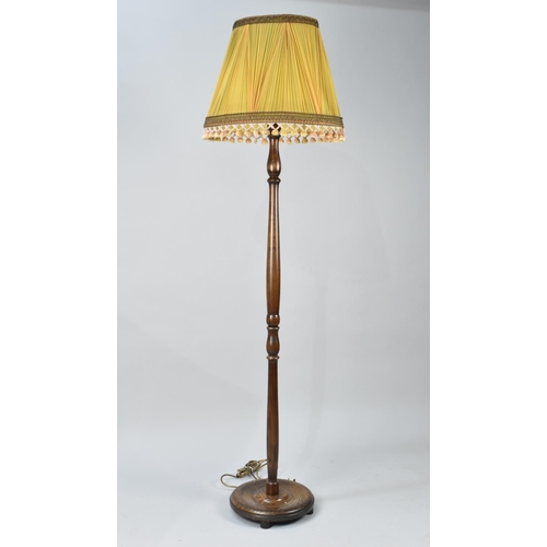 77 - A Mid 20th Century Turned Wooden Standard Lamp with Shade