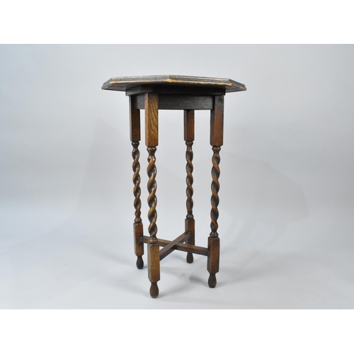 85 - An Edwardian Oak Octagonal Topped Occasional Table with Barley Twist Supports, 51cms Diameter