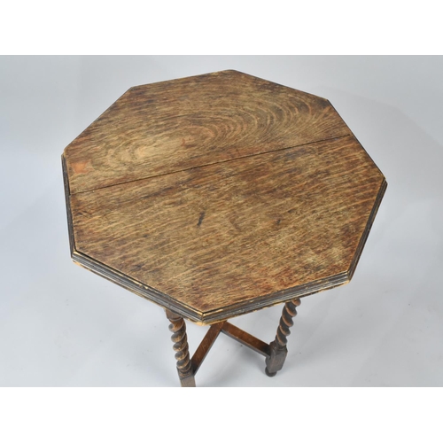 85 - An Edwardian Oak Octagonal Topped Occasional Table with Barley Twist Supports, 51cms Diameter