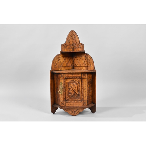 402 - A Small Edwardian Carved Oak Wall Hanging Corner Cabinet with Warrior Mask Decoration to Panelled Cu... 