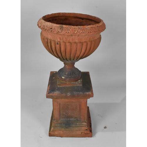 412 - A Terracotta Garden Urn on Plinth Base of Campagna Form, the Urn with Moulded Leaf Design Rim Over L... 