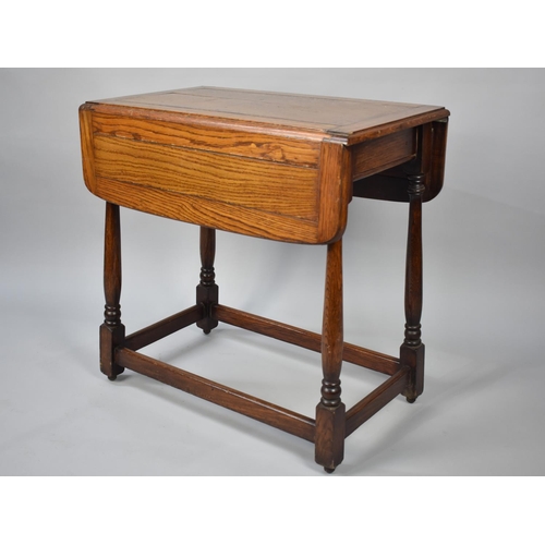 103 - A Mid 20th Century Oak Barley Twist Two Tier Drop Leaf Trolley, 65cms Wide