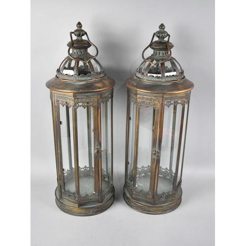 106 - A Pair of Bronzed Metal Cylindrical Octagonal Lanterns, 57cms High