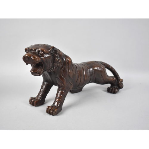 117 - A Modern Chinese Bronze Study of a Snarling Tiger, 32cms Long