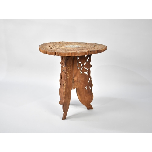 249 - A Far Eastern Carved and Pierced Circular Table on Folding Tripod Stand, 45cms Diameter