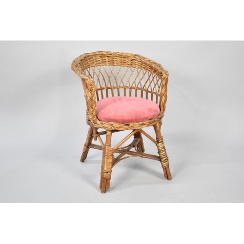 277 - A Childs Wicker Tub Armchair with Upholstered Circular Pad Feet