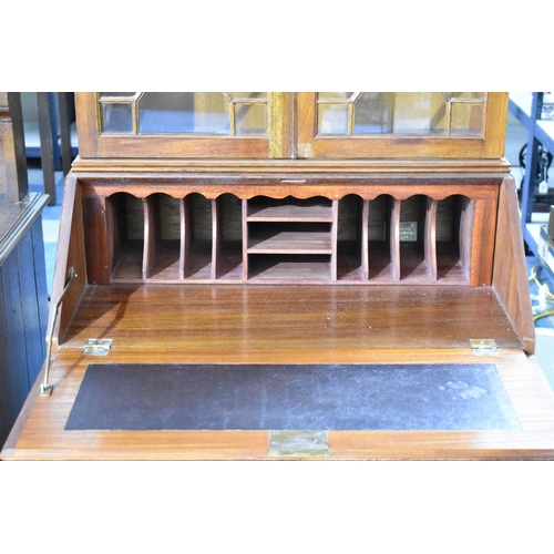 527 - A Late 20th Century Flame Mahogany Bureau Bookcase with Fall Front to Fitted interior. Four Long Bas... 