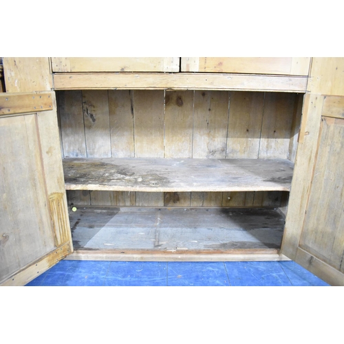 550 - A 19th Century Stripped Pine Double Pantry Cupboard with panelled Doors to Upper and Lower Shelf Sec... 