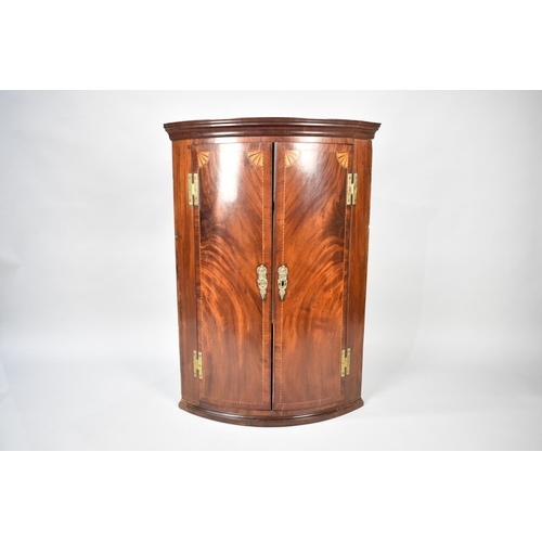 557 - A 19th Century Inlaid Mahogany Wall Hanging Corner Cabinet with Brass H Hinges, 70cms Wide and 100cm... 