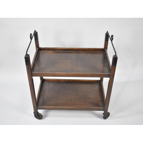 70 - An Edwardian Oak Two Tier Trolley with Metal Handles, 59cms Wide