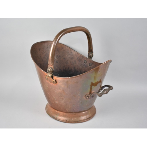 77 - A Vintage Copper Helmet Shaped Coal Scuttle with Loop Handle, 38cms High max