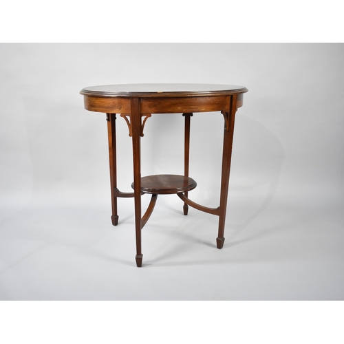 97 - An Edwardian Mahogany Oval Topped Occasional Table on Tapering Square Supports, with Oval Stretcher ... 