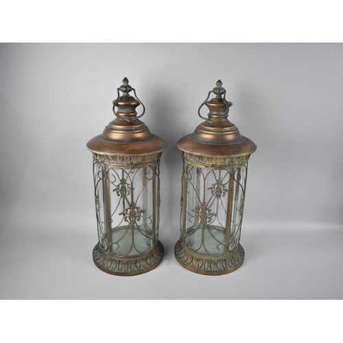 99 - A Pair of Cylindrical Bronzed Metal Lanterns, 57cms High