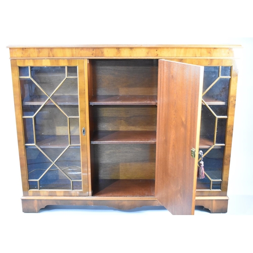 125 - A Late 20th Century Astragal Glaze Triple Bookcase in Yew with Panelled Centre Door, Flanked By Glaz... 