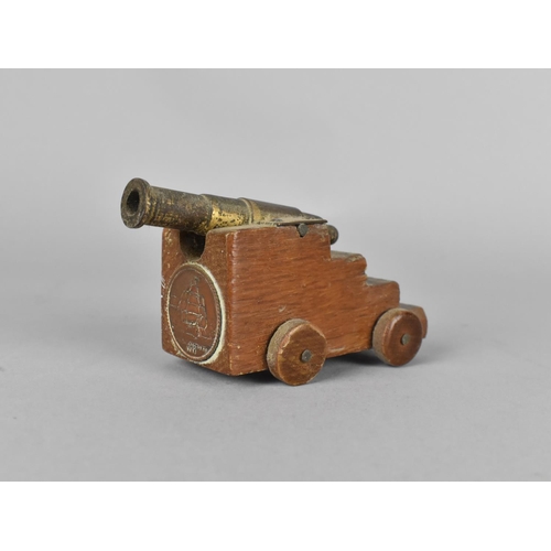 29 - A Small Souvenir Model of a Ship's Cannon With Inset 'HMS Victory' Medallion, 7.5cm long