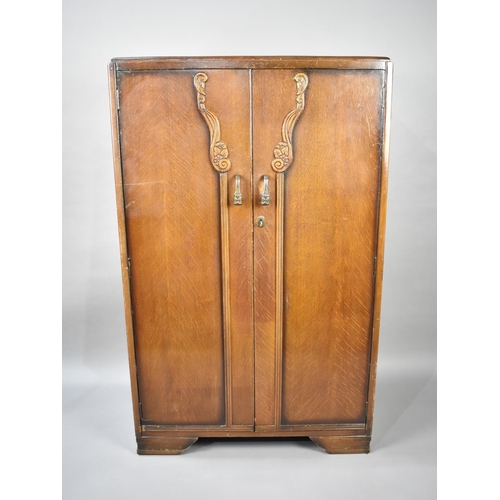 572 - A Mid 20th Century Oak Fitted Gentleman's Wardrobe, 76cm wide