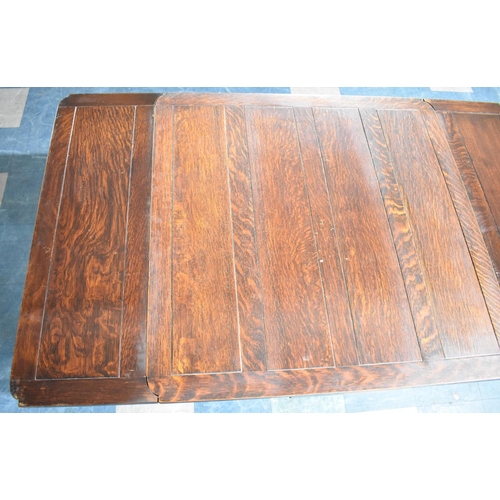 575 - An Edwardian Oak Draw Leaf Extending Dining Table on Carved Bulbous Supports Together with Four Oak ... 