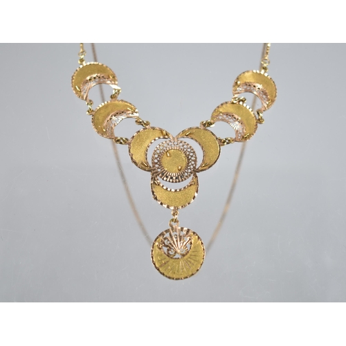 61 - A Two Tone Gold Metal Filigree Necklace Comprising Crescents Raised on Textured Plaques, Each 16mm W... 