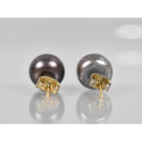 65 - A Pair of Chocolate Pearl Earrings Mounted to Centre with Single Round Cut Diamond Measuring Approx ... 